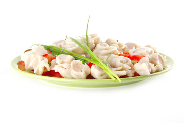dumplings with peppers on green