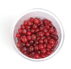 cranberries in plastic glass