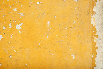 Old dilapidated plastered stone wall