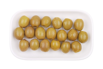 Green olives on a white plate
