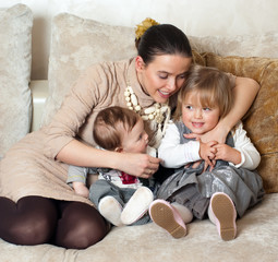 Young beautiful mother with her daughter and son