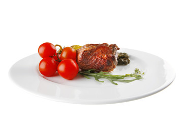 roast meat medallion with cherry tomatoes