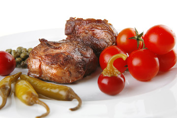 grilled meat medallion served on white