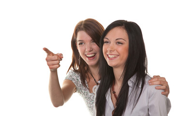 Two young women burst into laughter