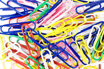 A pile of colorful peperclips isolated on white