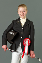 Young girl in riding clothes