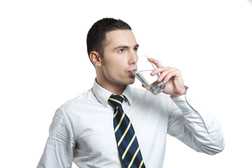 young man drinking water from a glass