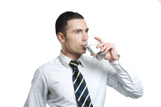 Young Man Drinking Water From A Glass