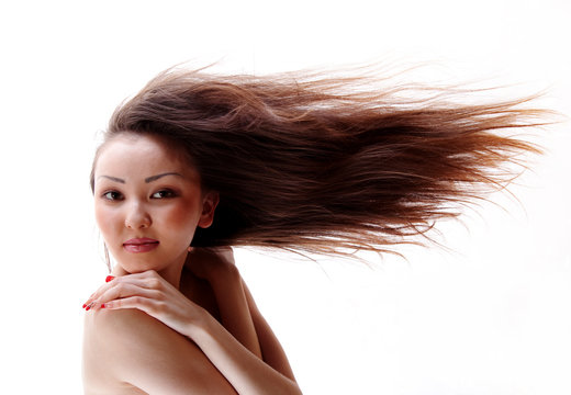 Portrait of the Asian girl with a flowing hair