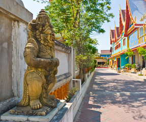 The statue of the demon near a Buddhist temple