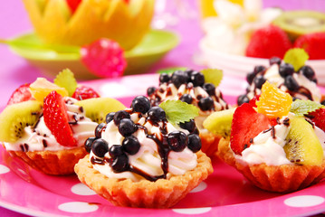 mini tartlets with cream and fruits