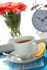 Fototapeta na wymiar Alarm clock on breakfast table