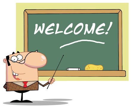 Male School Teacher Pointing To A Welcome Chalk Board