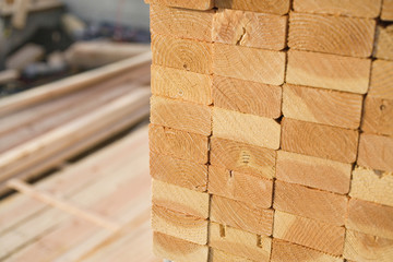 Stacks of Lumber at a Construction Site - obrazy, fototapety, plakaty