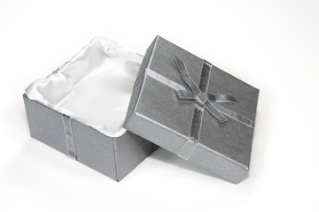 open silver gift box with ribbon and bow