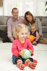 Fototapeta na wymiar Smiling toddler with ball