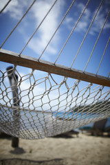 empty hammock on a sandy beach