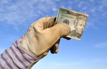 Worker Holding a Twenty Dollar Bill