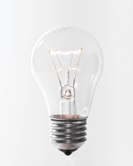 Lit light bulb, isolated on white
