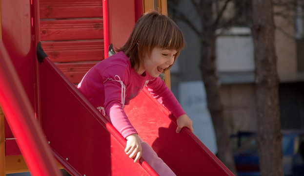 Girl On Red Slide