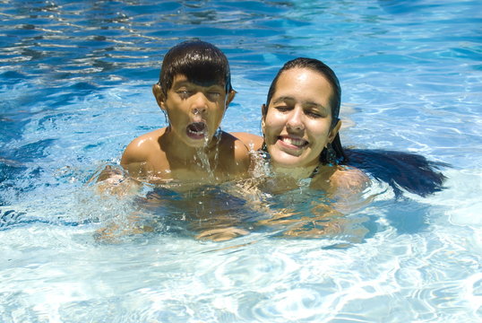 Boy and Woman in Pool