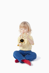 boy with toy trumpet
