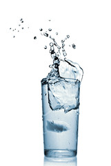 water splash in glass isolated on white