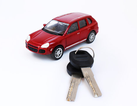 Red toy car model with keys