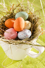 Fototapeta na wymiar Easter chocolate eggs in the nest.