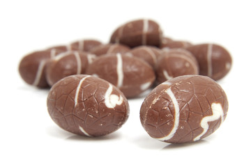 chocolate easter eggs over white background