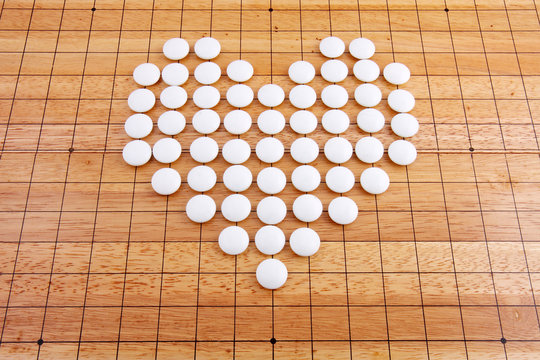 A white heart in a japanese go board