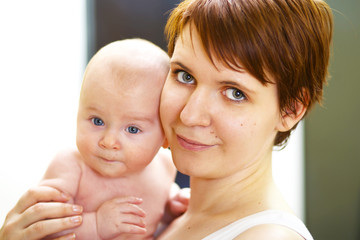 happy young mother with baby boy
