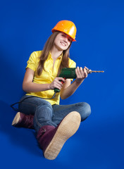 Naklejka premium Girl with drill