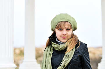 girl wearing beret near the columns