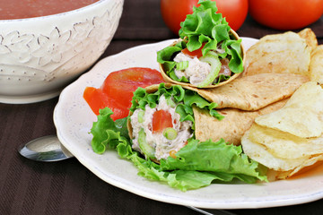 Tuna salad wraps, chips and tomato soup.