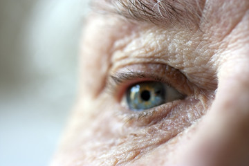 close up on elderly ladies eye and wrinkles