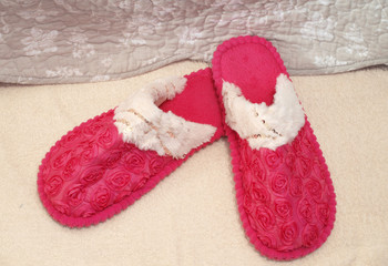 Pink slippers on the carpet
