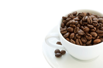 white cup with coffee and beans