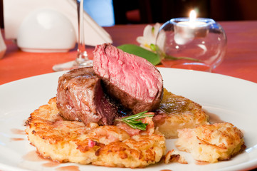 closeup of a Rossini veal with fried potatoes