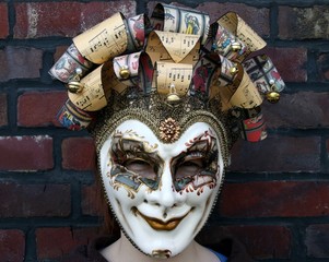 Girl wearing a venetian carnival mask (derisive gaze)