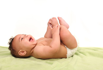 Infant Happily Shrieking in Laughter While Lying Down