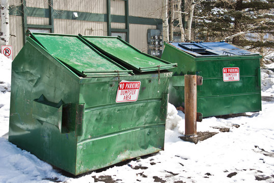 two green dumpsters