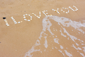 I Love you in sand on a a beach