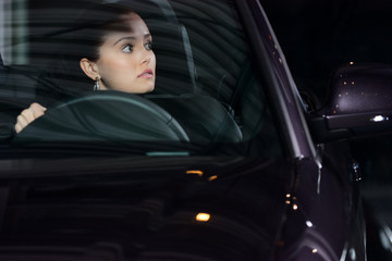 young pretty woman driving car