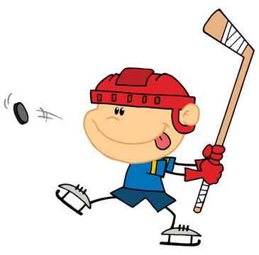 Sporty Caucasian Boy Preparing To Whack A Hockey Puck