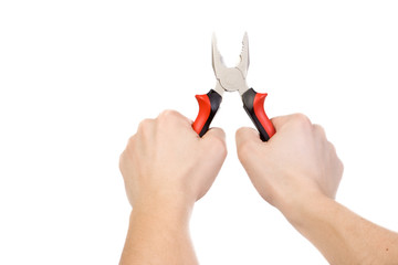 hands holding red pliers