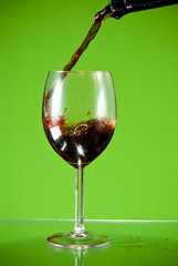 Red wine poured into glass