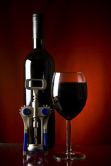 Red wine, bottle and bottle-opener