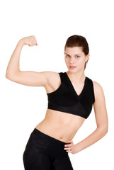 Fototapeta na wymiar young woman showing off muscles