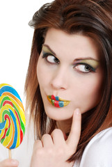 young woman with colorful lolipop